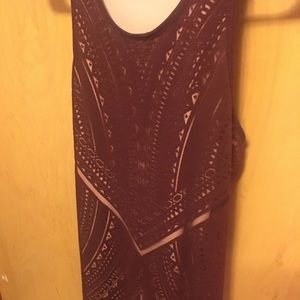 Wine colored body con dress with a razor back.